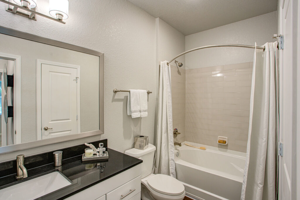 Bathroom with toilet and tub shower